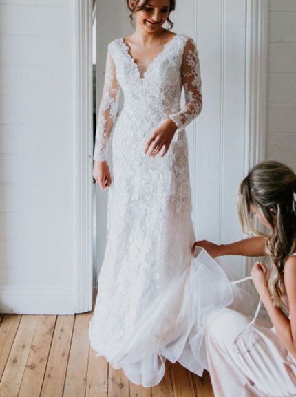 Elegant Lace Wedding Gown with Long Sleeves and Plunging Neckline
